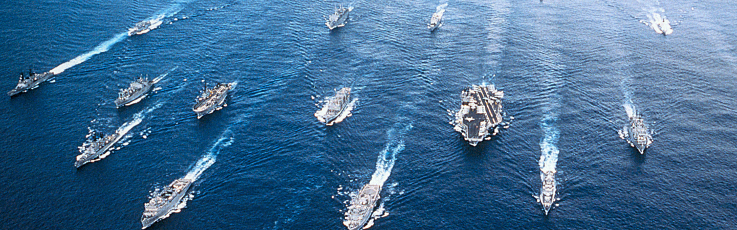 An aerial photo of a group of U.S. Navy ships.