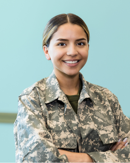 A female service member smiles for a photo.