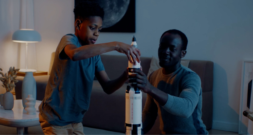 Father and son wokring on a model rocket.