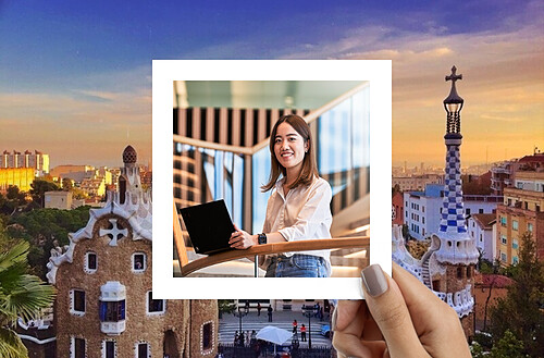 A hand holds a photo of four smiling people taking a selfie, with a vibrant city nightscape in the background.