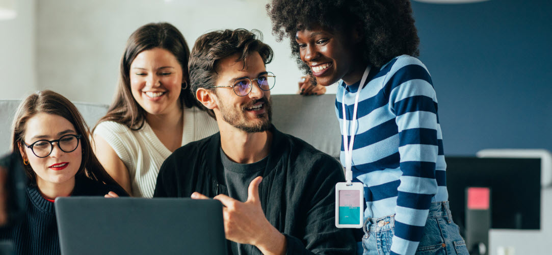 A Team of Great People working around a laptop