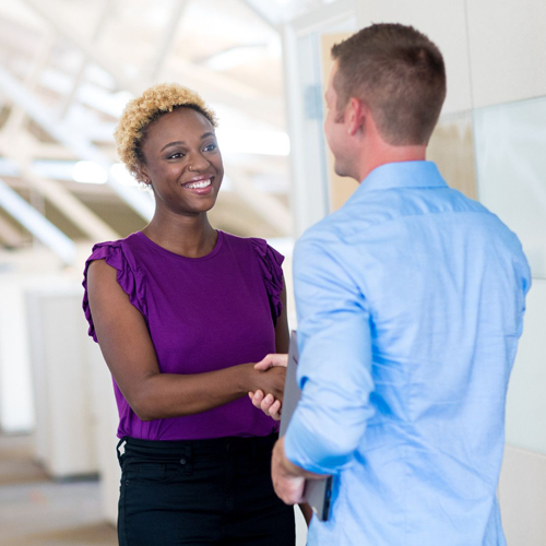 woman and man shaking hands