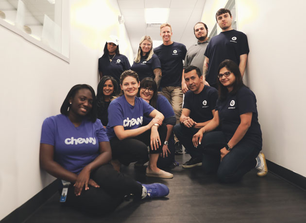 A trainer providing a team member with a certificate