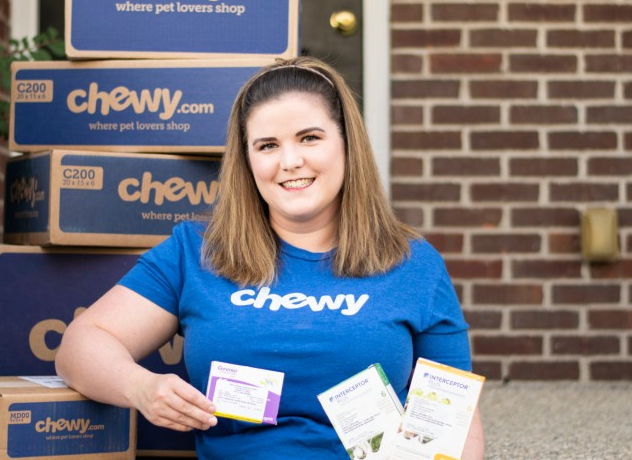 A Chewy Pharmacy team member smiling at the camera