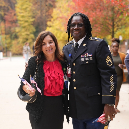 Children’s staff member in military uniform during Veterans breakfast event.