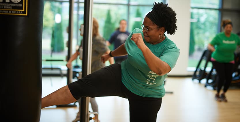 woman kicking in exercise class