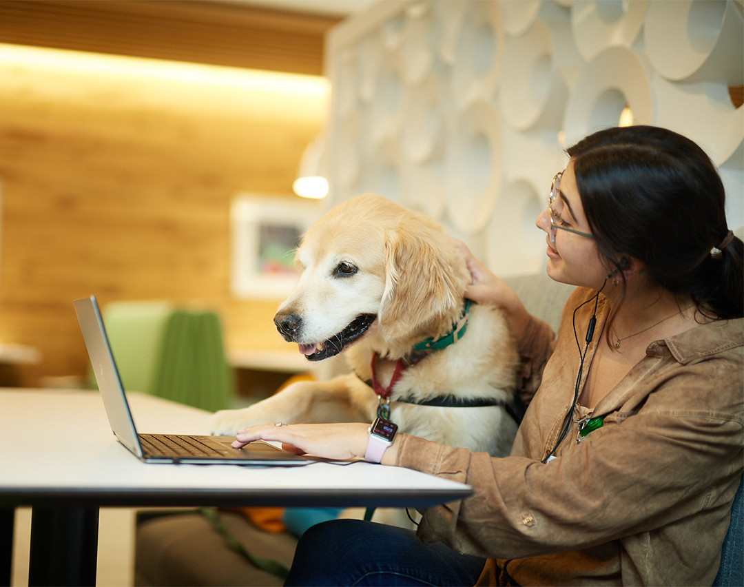employee with therapy dog at Children's