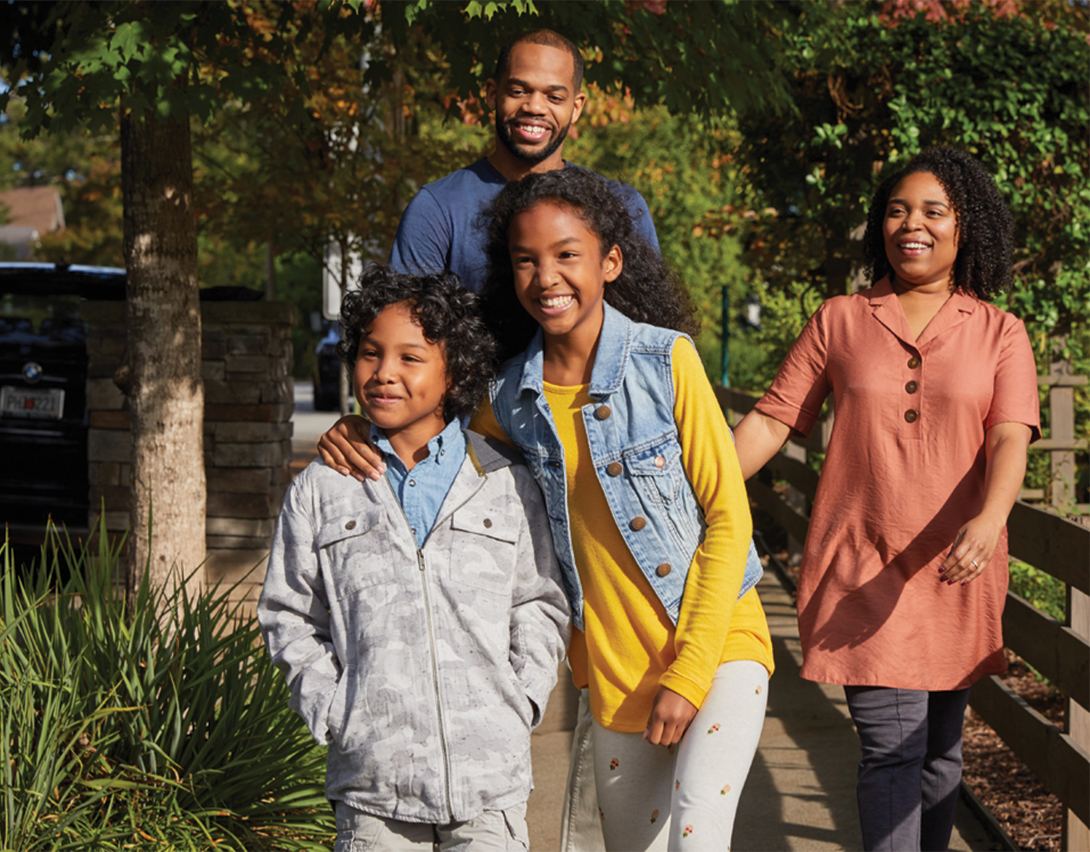 healthy family walking in park