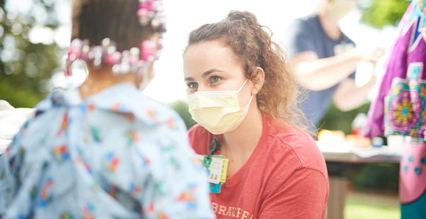 nursing smiling at patient