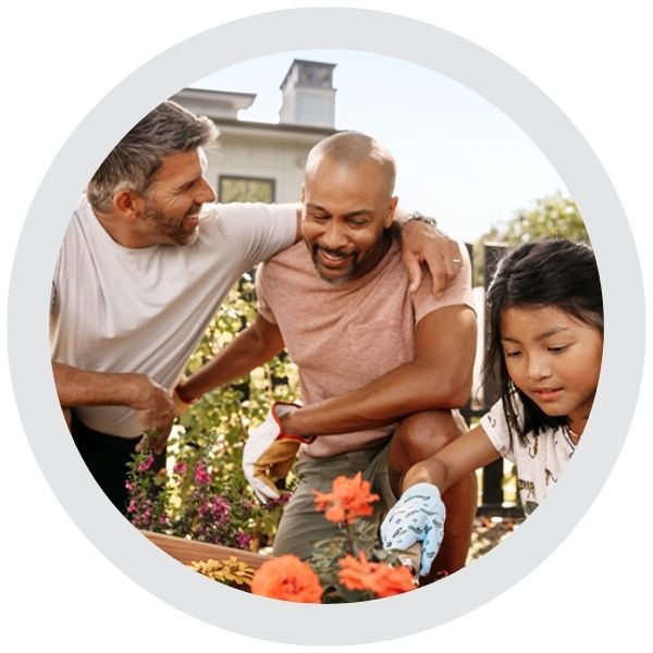 People working together in a garden planting flowers outdoors 