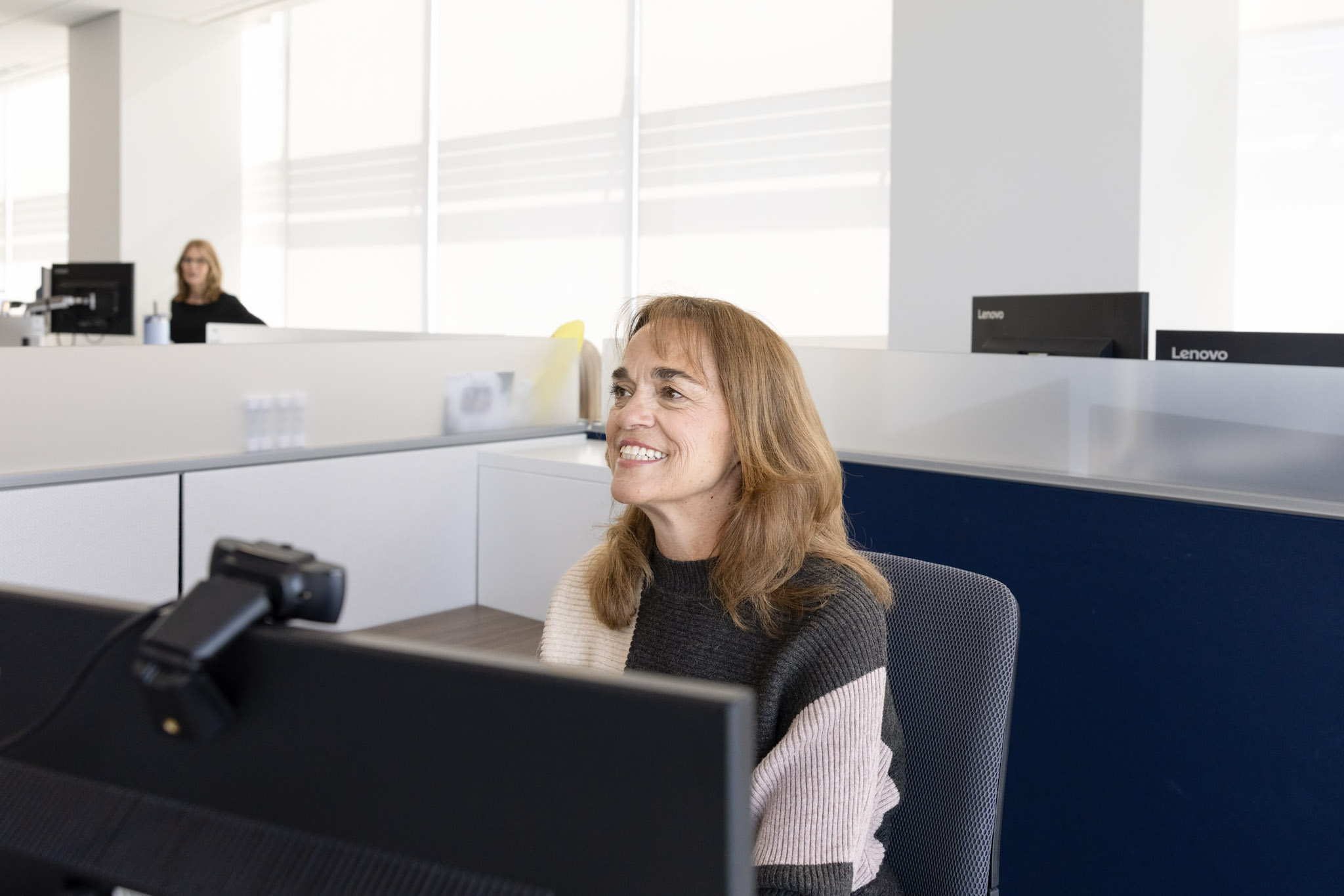 An employee in front of her computer
