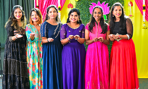 Female dancers in traditional dress to celebrate the holiday of Diwali