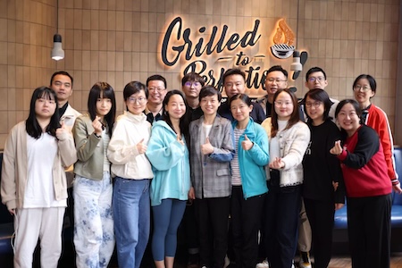 China employees smiling for a group photo