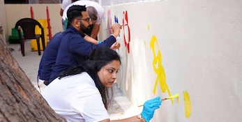 Evernorth India employees painting together