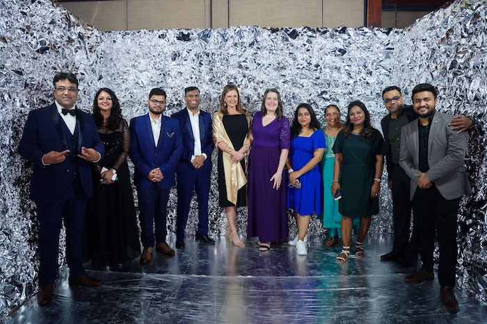 Evernorth employees posing for group photo at an event