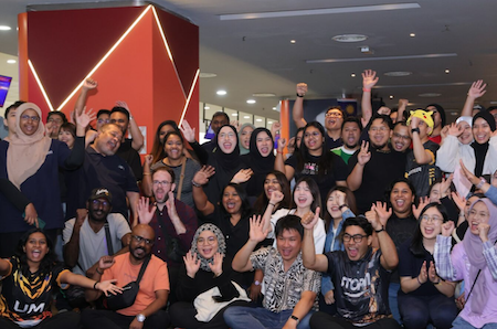 Employees at our Kuala Lumpur office posing together during a bowling outing