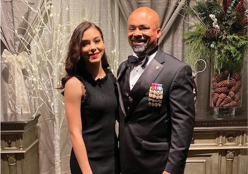 Linus J. smiling for a photo at a formal event