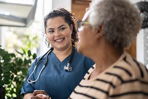 Nurse helping patient