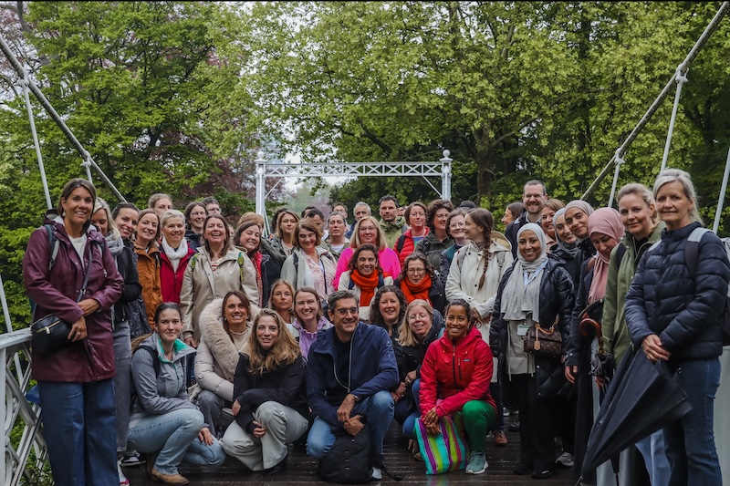 Belgium employees posing for a group photo outdoors