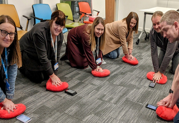 UK employees participating in a team CPR event