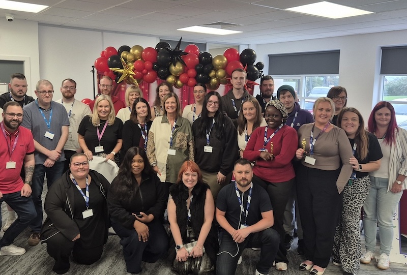 UK employees posing for a group photo