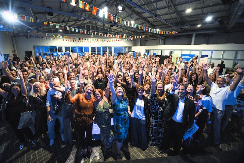 Spain employees gathered for a photo at an office celebration