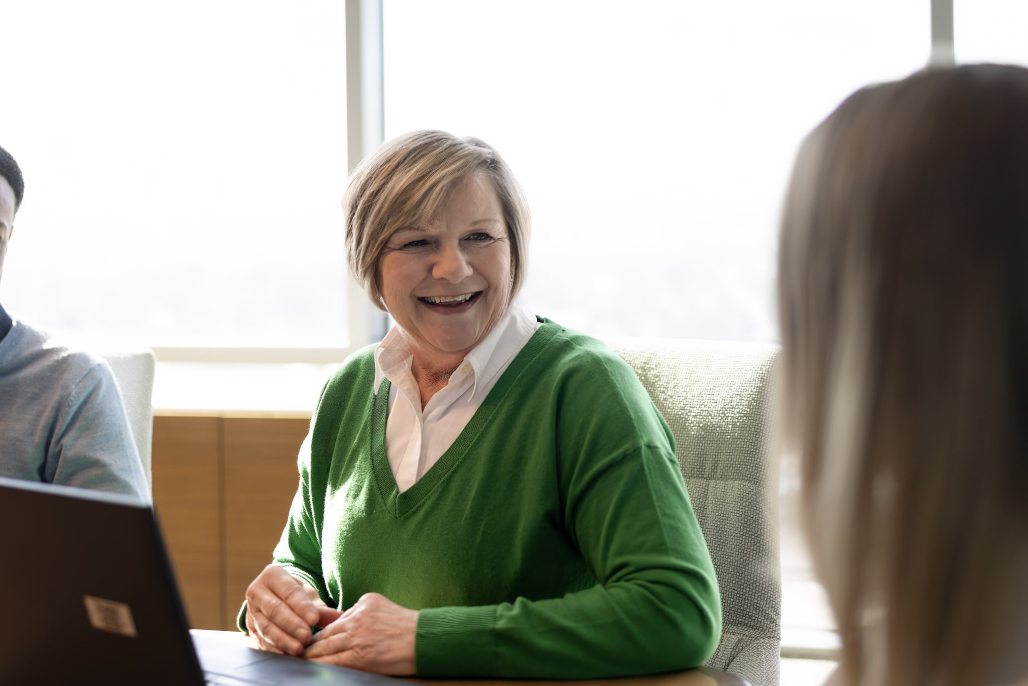 An employee smiling in the conference room