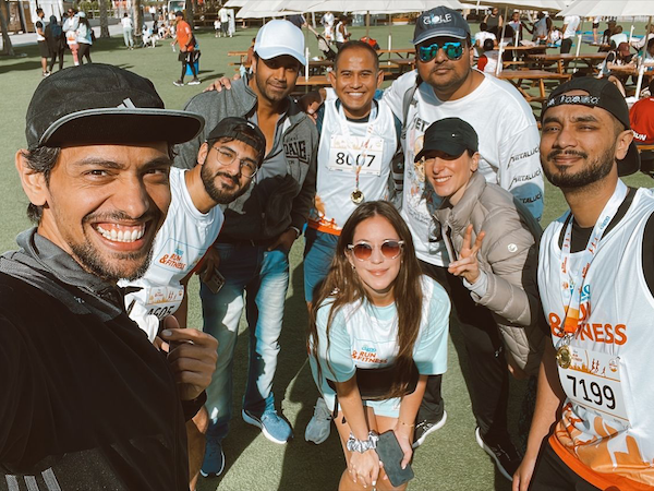 UAE employees posing for a group photo at a company run
