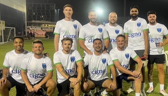 UAE employee sports team posing for a group photo