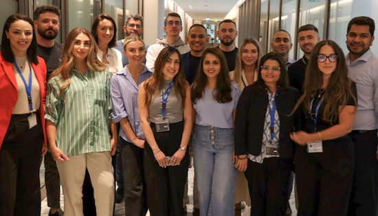 UAE employees posing for a large group photo