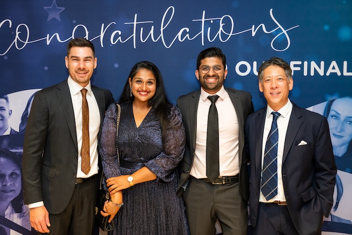 Australia employees posing for a group photo at a company celebration