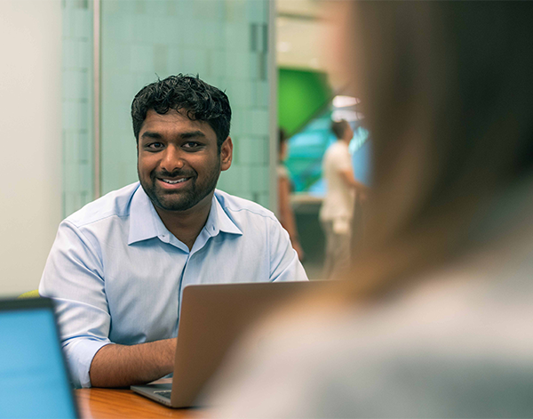 Man working at his laptop in an office