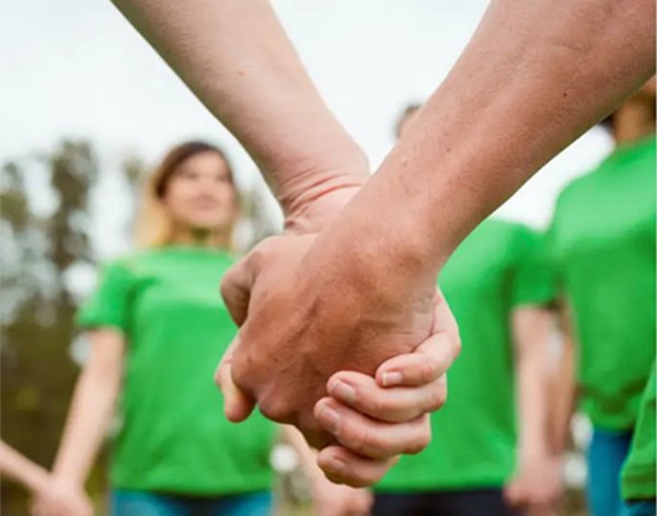 People clasping hands