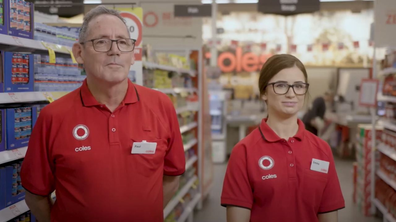 Paul and Emma (two Coles employees) standing next to each other at Coles