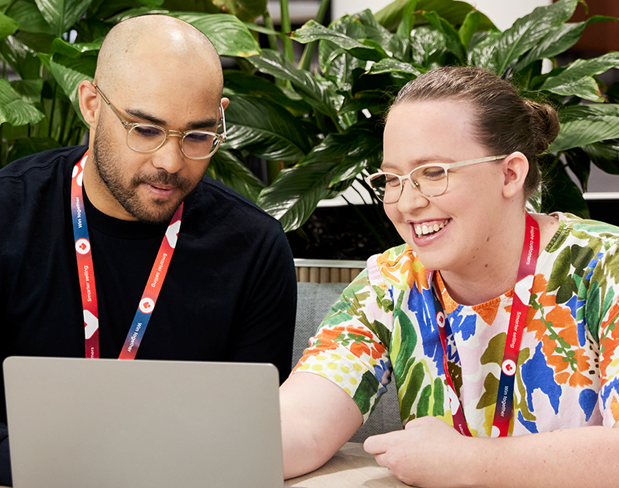 Two Coles corporate employees working in the Coles Store Support Centre