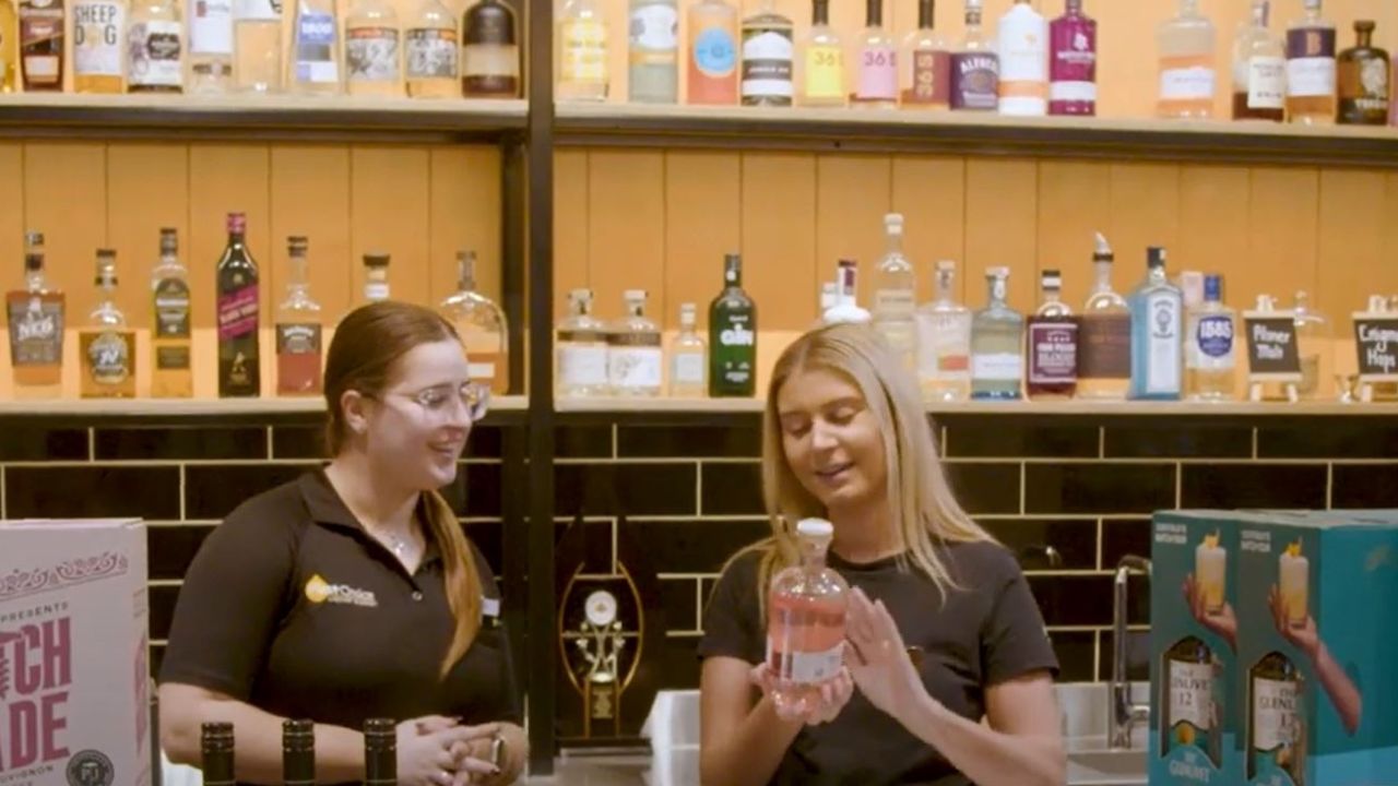 Two female first choice liquor market store managers interacting in store