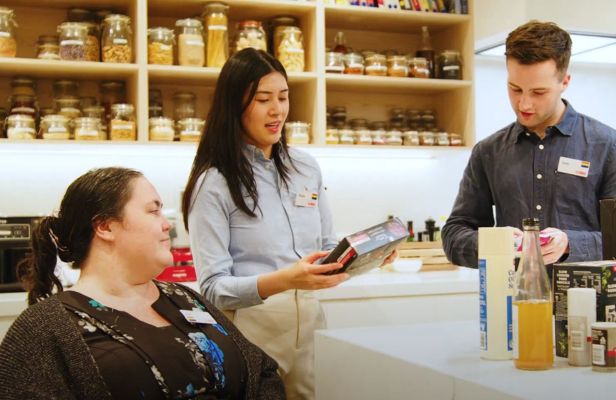 Coles Team Members working together, one team member has a disability