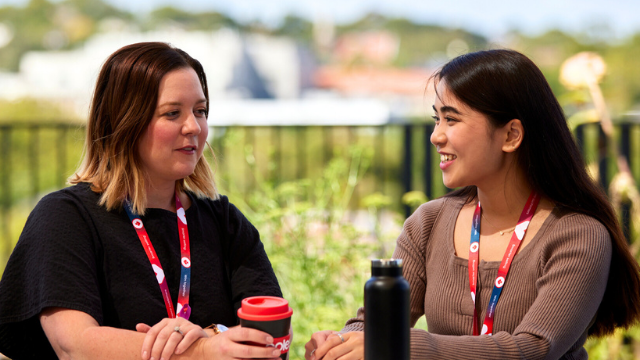 People and Culture Team Members enjoying a meeting outside
