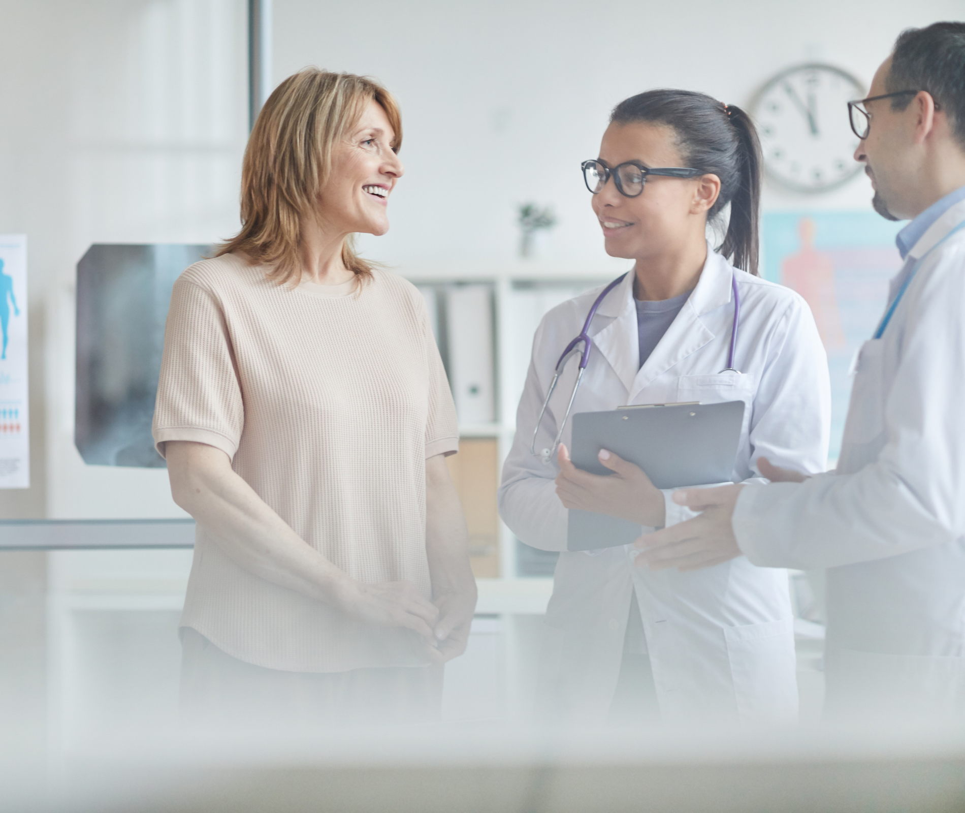 Woman talking with doctors