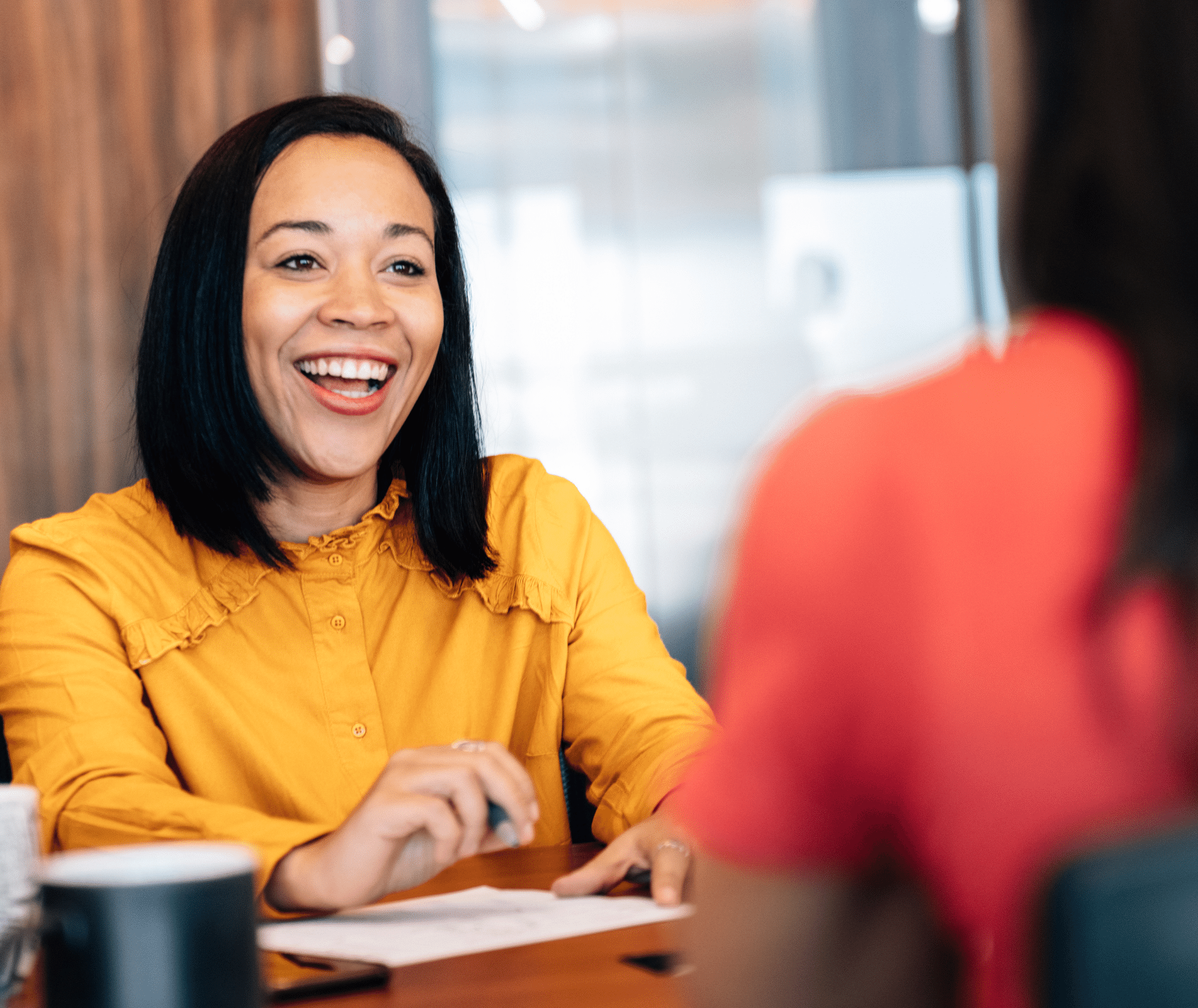 Employee smiling with computer