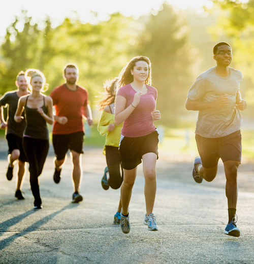 Group of people running in park