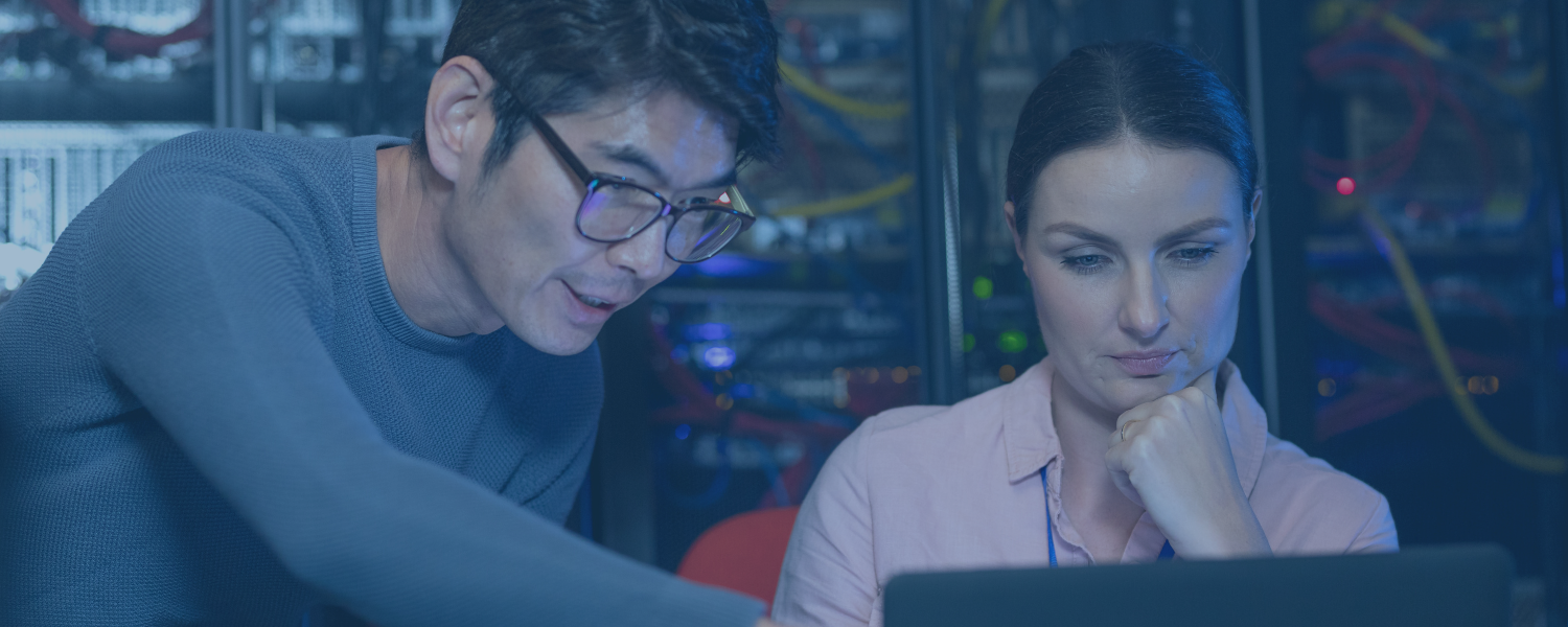 IT employees talking in server room
