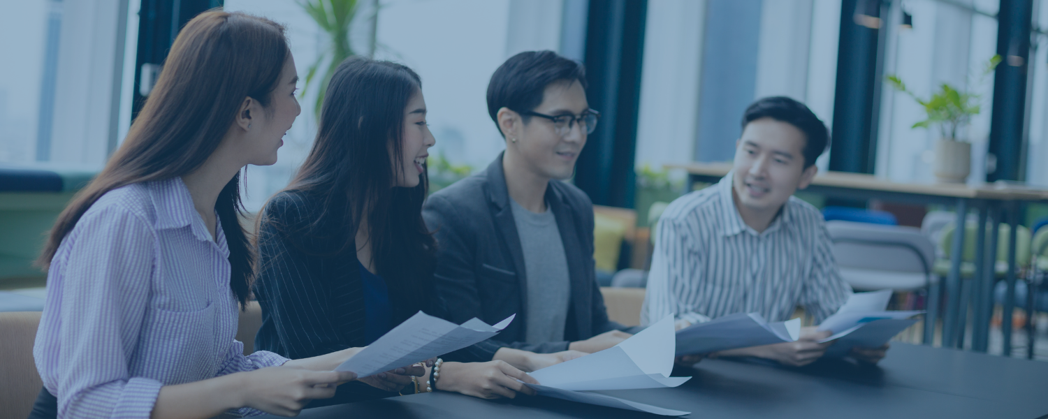 Marketing employees talking together at a table