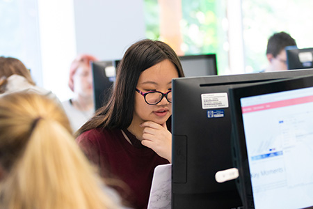 Person looking at a computer screen