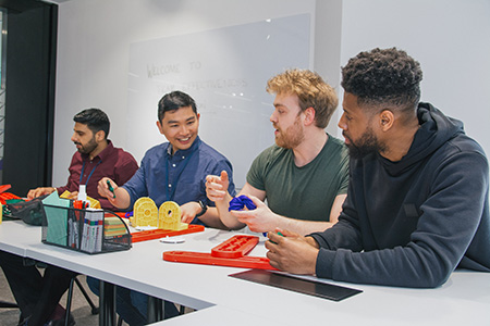 group of people working on a team building puzzle