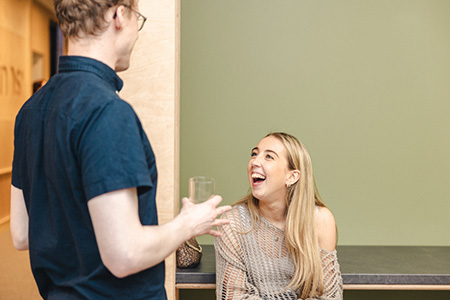 Two people talking and laughing