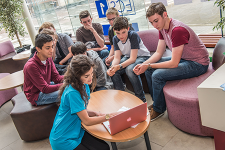 group of students around a table