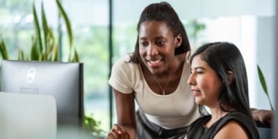 Two women looking at a computer
