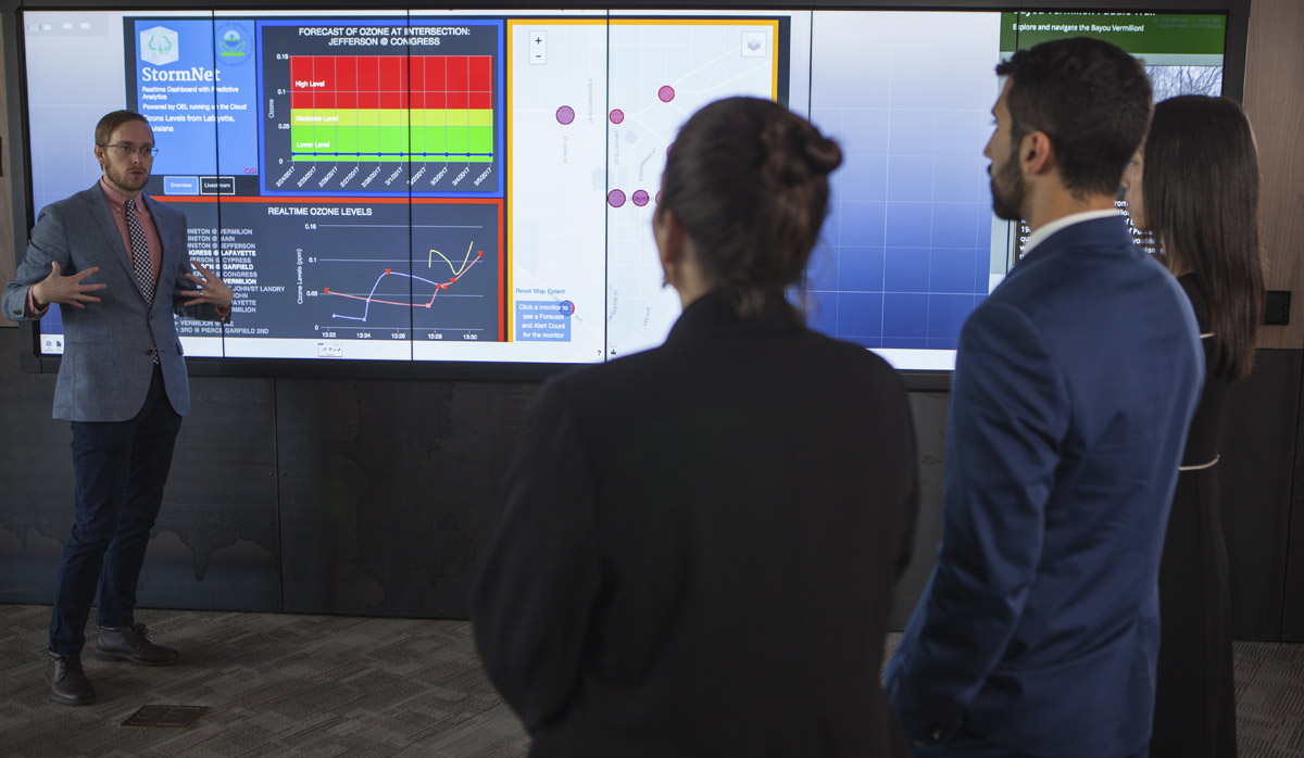 CGI employee presenting on a digital display