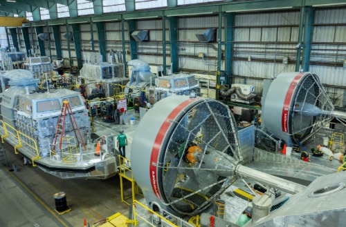 Large-scale Textron Systems manufacturing floor assembling advanced defense and aerospace equipment.